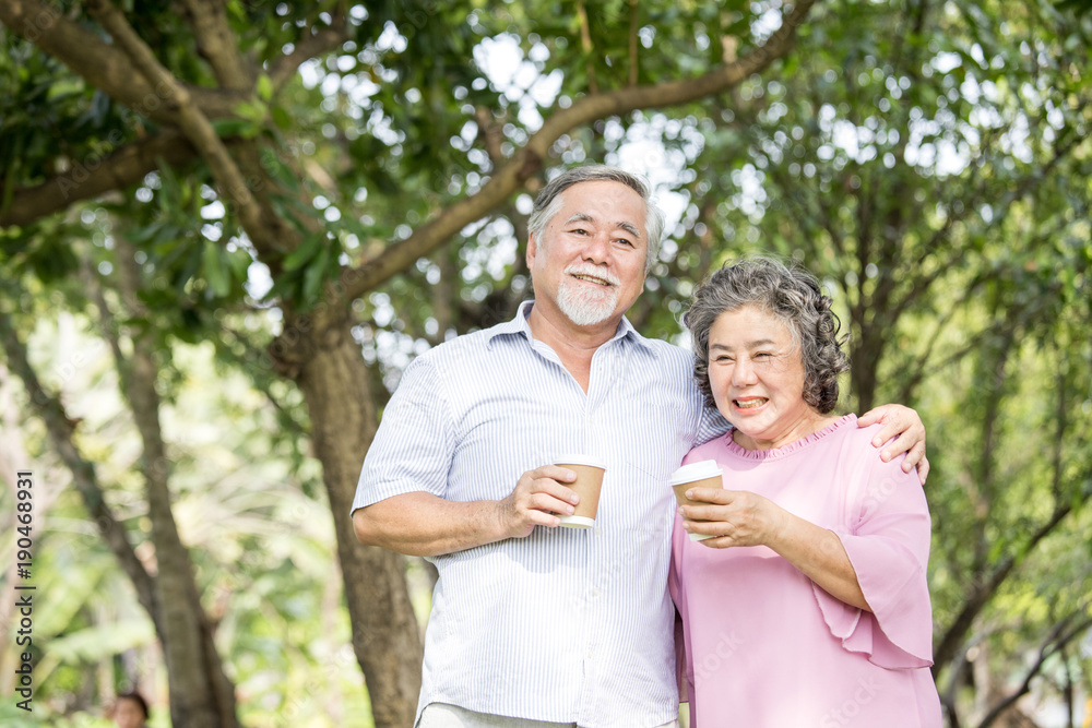 Asian Senior couple smiling together at outdoor park. People lifestyle concept. Asian Senior couple smiling together at outdoor park. People lifestyle concept.