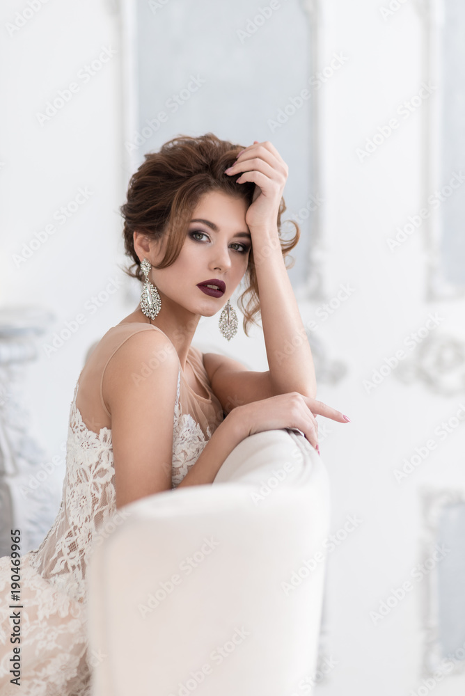 Beautiful bride sitting on the couch. Beautiful bride sitting on the couch.