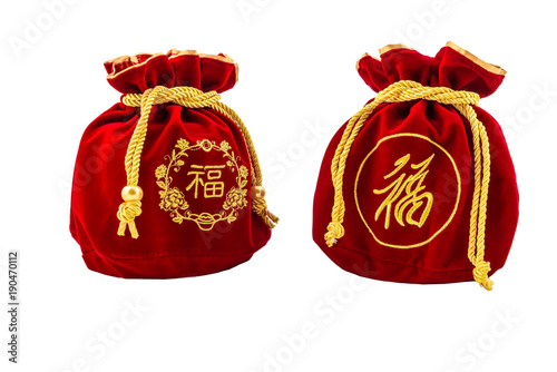 Chinese New Year Red fabric or silk  bag, ang pow of luck isolated on white