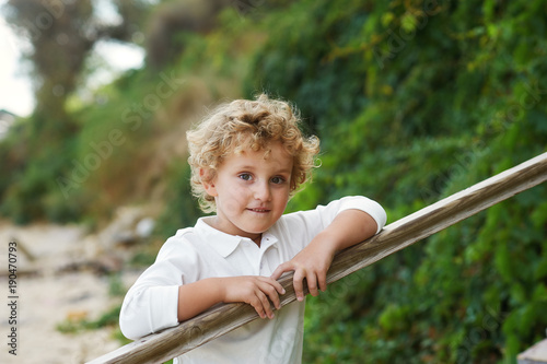 Portrait of the curly boy blond