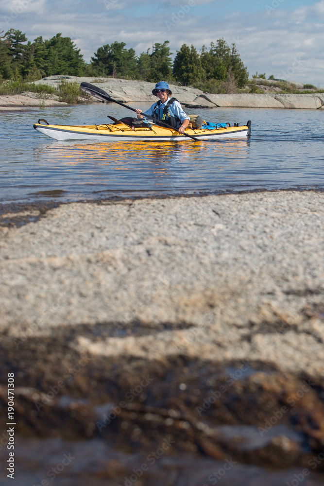 Senior Mature Woman Sea Kayaking