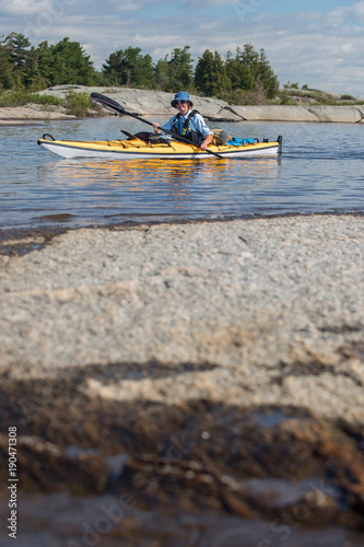 Senior Mature Woman Sea Kayaking