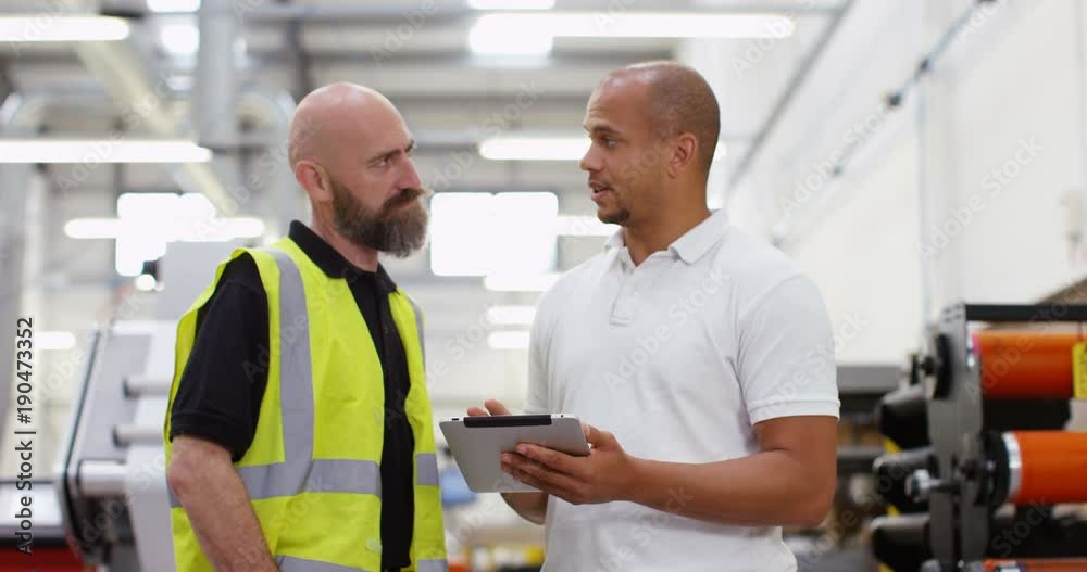 4k, Business partners shake hands on a factory floor. Slow motion. 4k, Business partners shake hands on a factory floor. Slow motion.