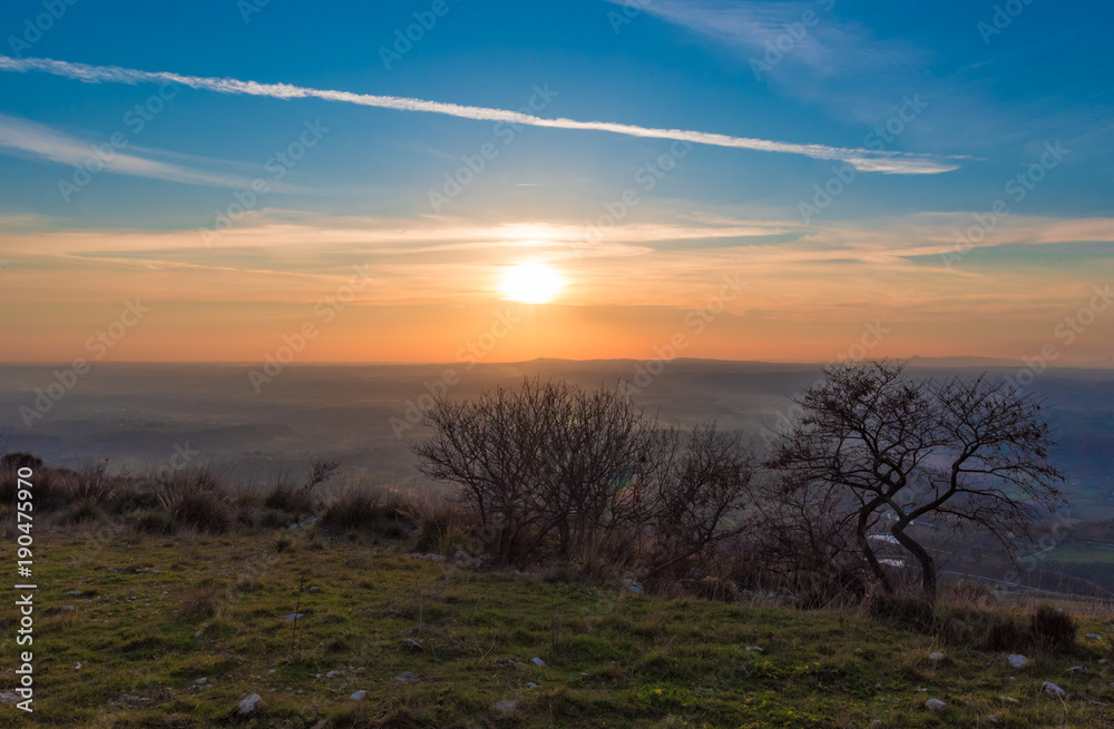 Fototapeta premium Fara in Sabina (Italy) - The sunset from 'Ruderi di San Martino', ruins of an old abbey, in province of Rieti beside Farfa Abbey, Sabina area, central Italy