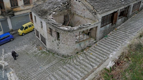 Albania, Gjirokaster. View from above to the street and roofs. Pan 