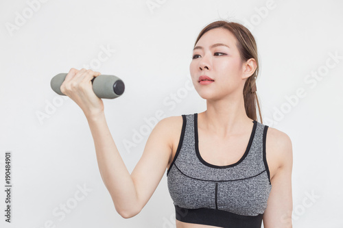 Beauty Asian woman work out with dumbbell,Isolated on white background