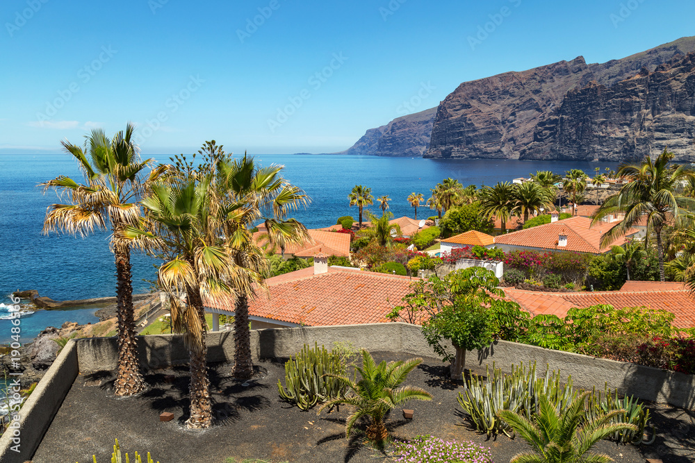 Naklejka premium Giant rock formations known as Acantilados de Los Gigantes, located in Los Gigantes, a resort town in the Santiago del Teide municipality on the west coast of the Canary Island Tenerife, Spain