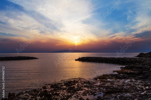 Sunset on Tenerife Island with breakwaters and rocks. Canary Islands  Spain