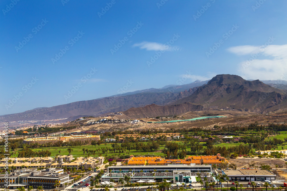 View on the mountains and Los Cristianos resort on Tenerife, Canary Islands, Spain