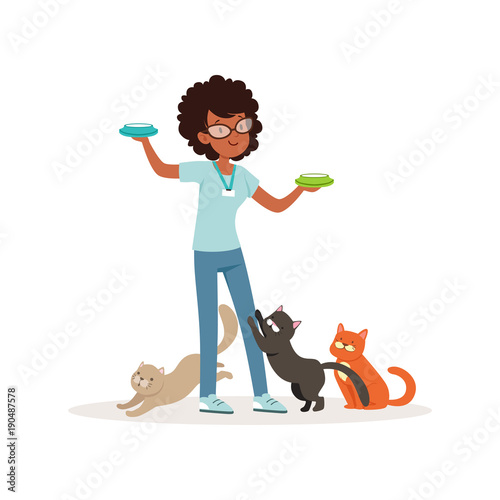 Cute curly-haired girl feeding homeless cats. Volunteer holding bowls with milk. Social help. Teen in glasses, blue t-shirt and jeans. Flat vector design
