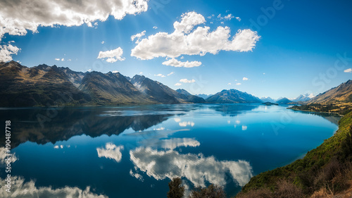 Sun rays at Lake Wakatipu from the scenic road from Queenstown to Glenorchy, New Zealand, South Island