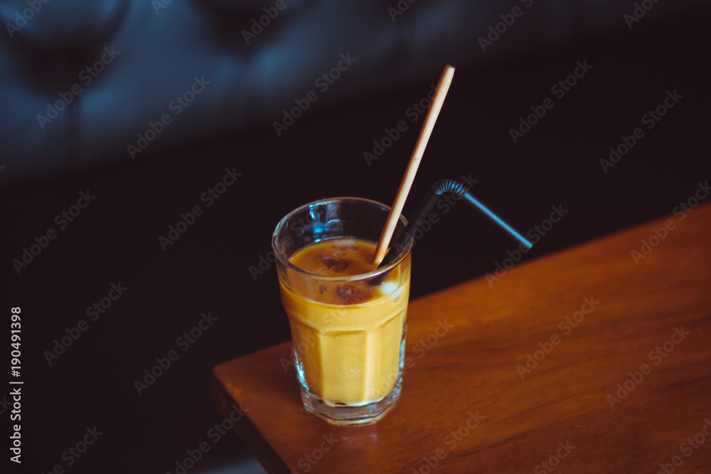 Iced coffee on a wooden table Iced coffee on a wooden table