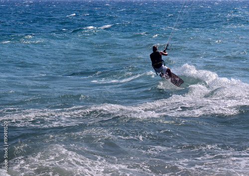 Kitesurfer on the sea wave