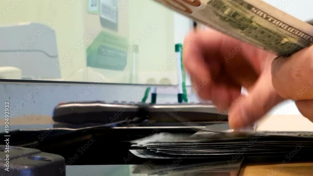 Close-up of a man counting money. Close-up of a man counting money.
