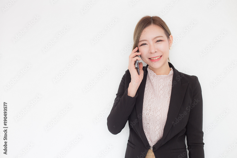 Asian business woman talking with customer in mobile phone,Isolated on white background Asian business woman talking with customer in mobile phone,Isolated on white background