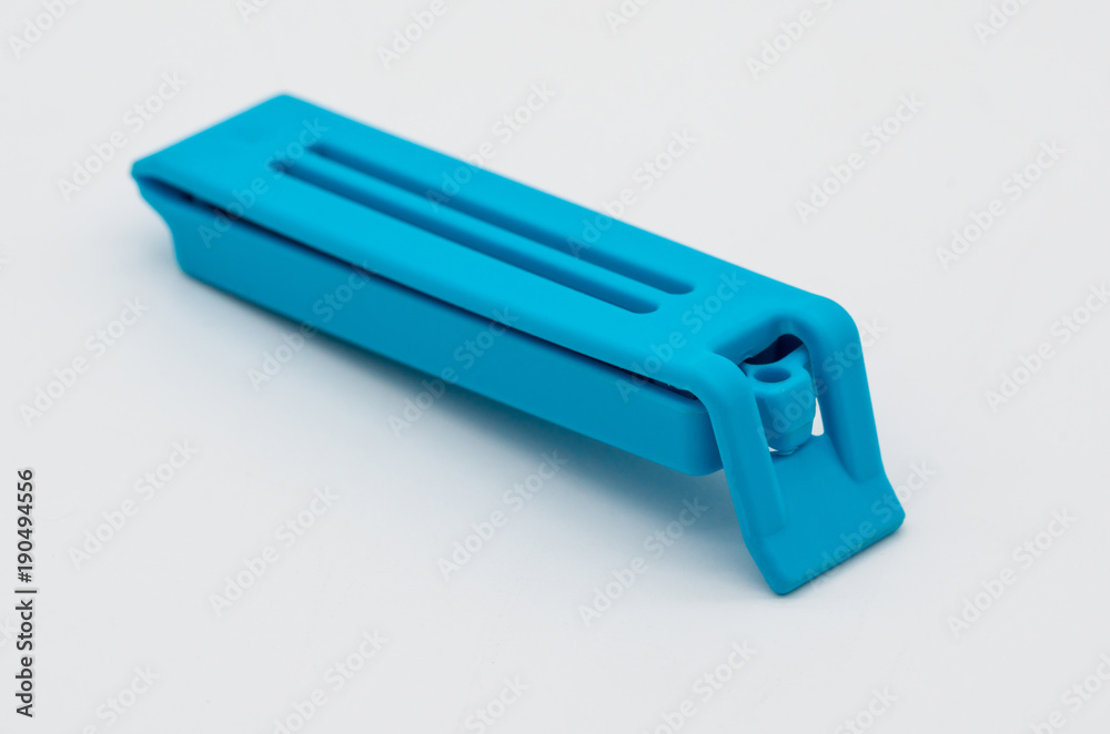 Blue bag clip isolated on the white Blue bag clip isolated on the white