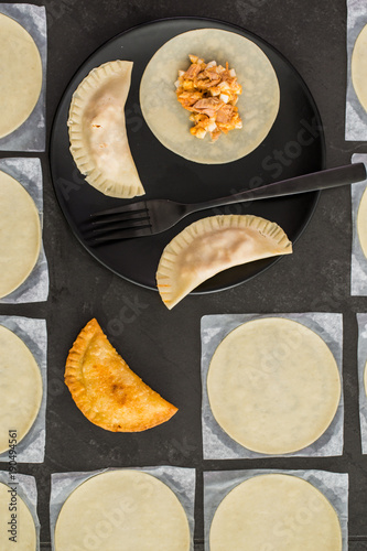 Overhead view of preparation of empanada photo