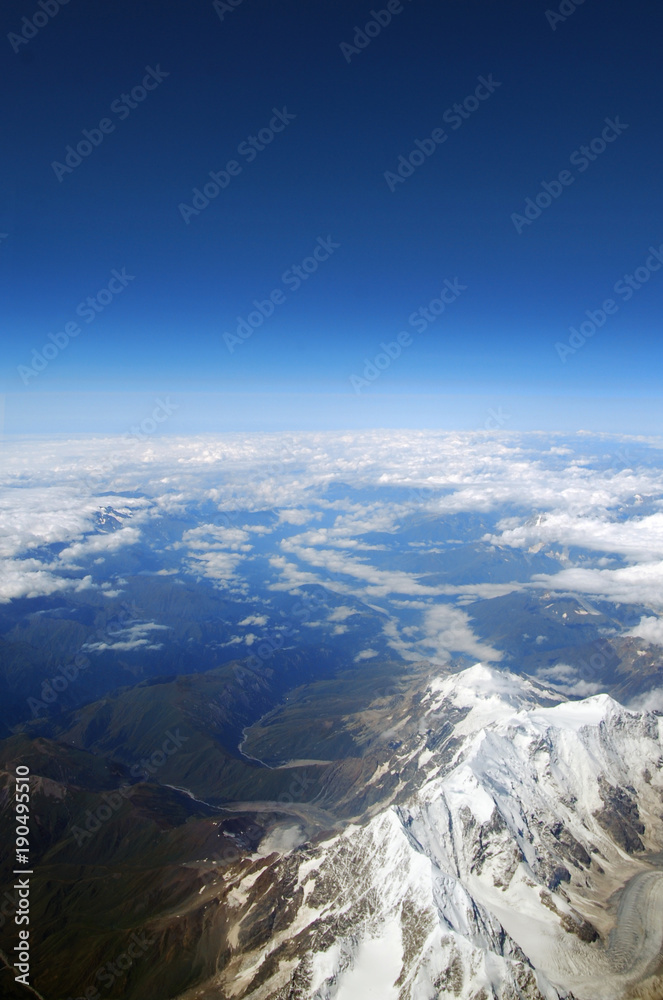 View from the airplane window on mountains View from the airplane window on mountains
