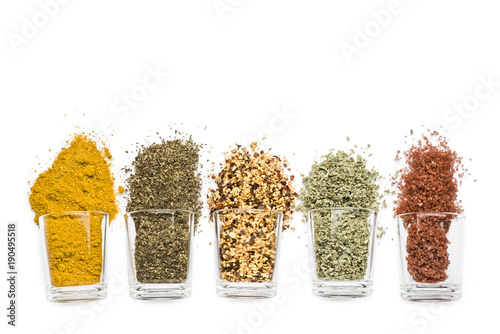 Fototapeta Naklejka Na Ścianę i Meble -  glass jars with various spices on white background with copy space