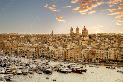 Malta, Valletta, Three cities at sunset. View on Vittoriosa Yacht Marine, located across the Grand Harbour from Valletta. Basilica of the Nativity of Mary in Senglea on the right side. #190496946