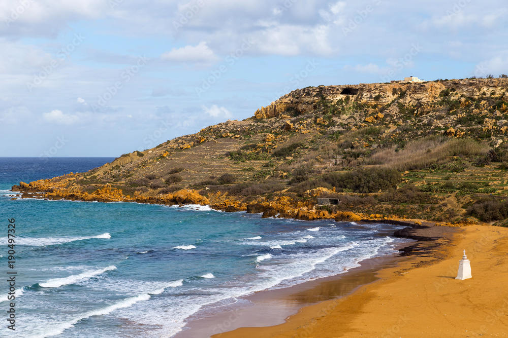 Cave of Calypso, where legendary mythic goddess kept Odyssey. Located in a cliff just off overlooking Gozo island. The most sought-after sandy beach, Ramla Bay. Cave of Calypso, where legendary mythic goddess kept Odyssey. Located in a cliff just off overlooking Gozo island. The most sought-after sandy beach, Ramla Bay.