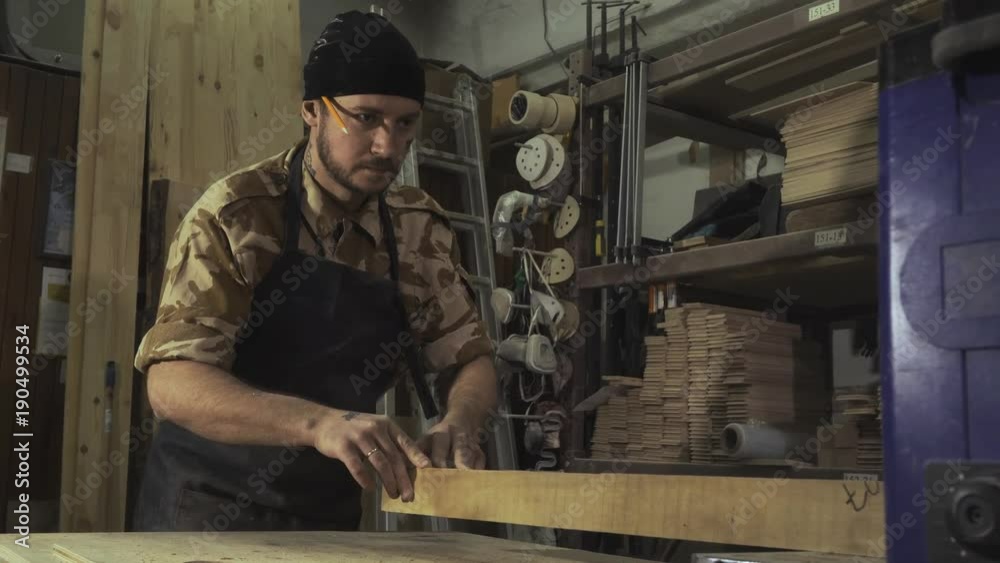 Workman in joinery workshop. Workman in joinery workshop.