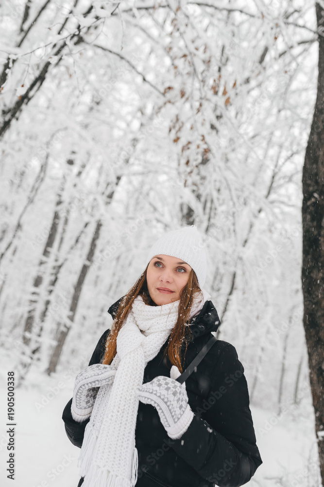 Beautiful young girl in a white winter forest Beautiful young girl in a white winter forest