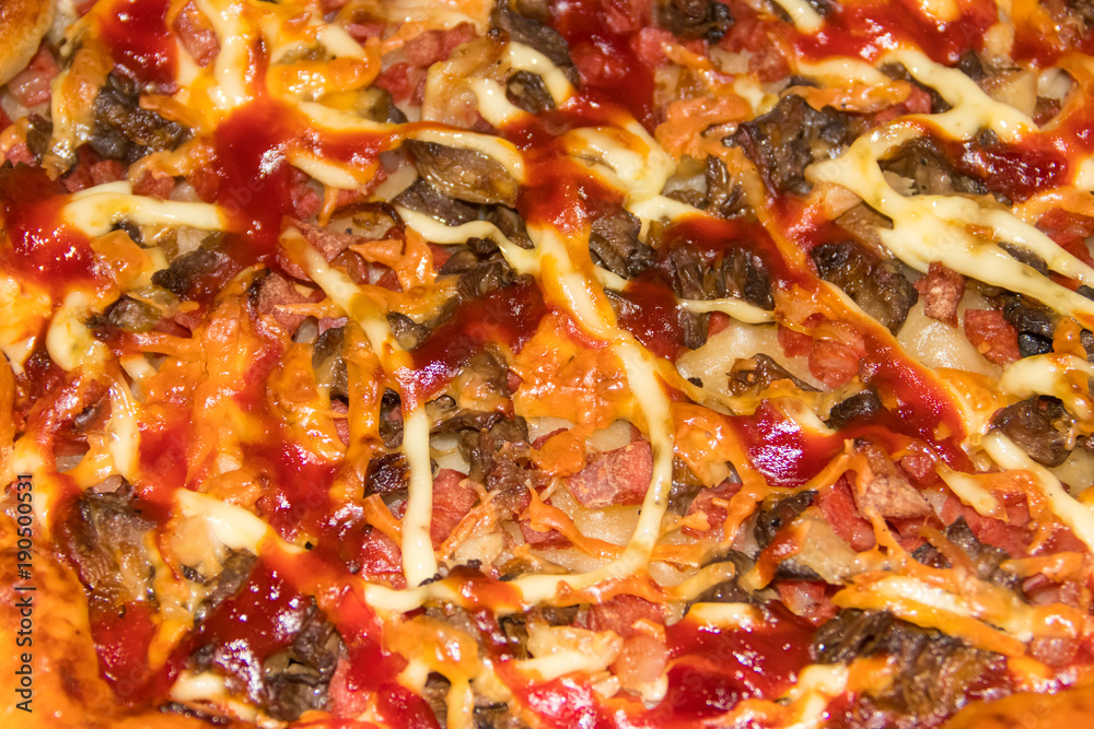 Texture of delicious pizza with salami, cheese and mushrooms. Food background Texture of delicious pizza with salami, cheese and mushrooms. Food background