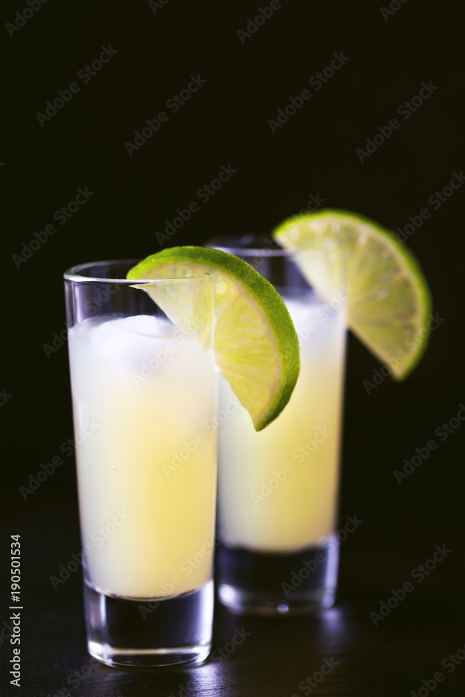 Italian lemon lime liqueur limoncello with ice and mint Italian lemon lime liqueur limoncello with ice and mint