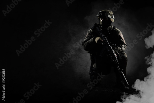 The man in the image of a member of the SWAT police with weapons