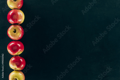 top view of arranged fresh apples isolated on black