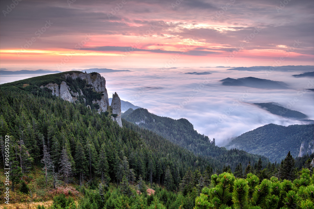 Beautiful mountain landscape of a foggy morning, Ceahlau massif, Eastern Carpathians, Moldova, Romania