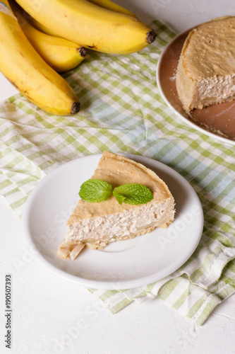 Banana cream pie on a white plate