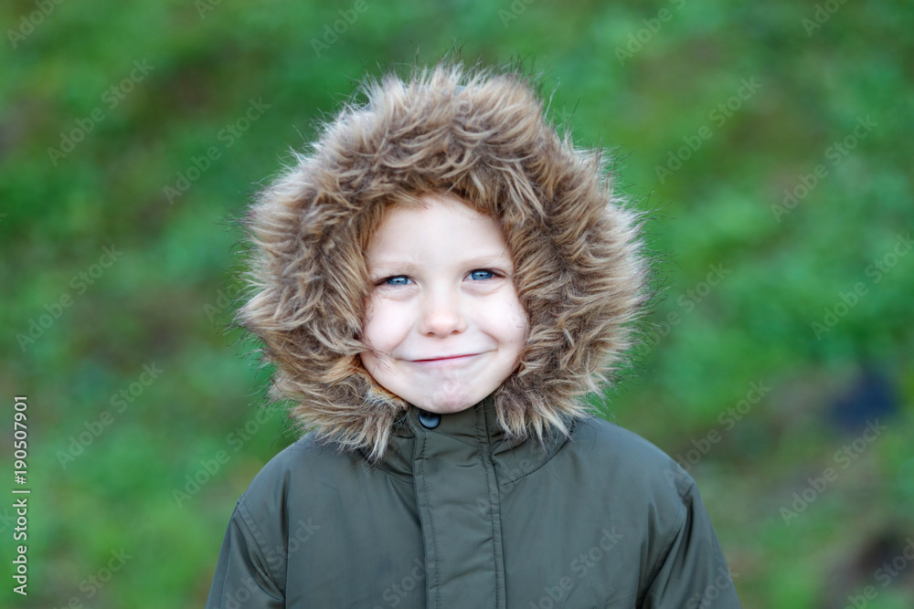 Small child in the park with a warm coat Small child in the park with a warm coat