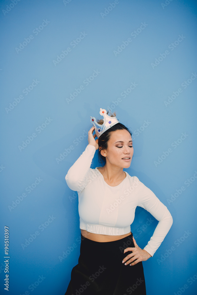 Portrait of beautiful fashion girl on blue background Portrait of beautiful fashion girl on blue background