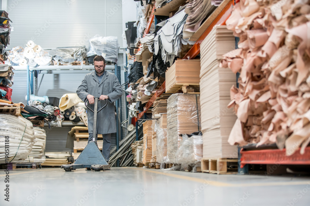 Working at leather warehouse at shoe factory used warehouse equipment