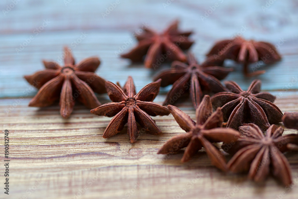 Anise stars close-up on a wooden background Anise stars close-up on a wooden background