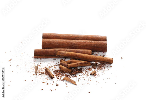 Fototapeta Naklejka Na Ścianę i Meble -  Cinnamon sticks with shavings isolated on white background