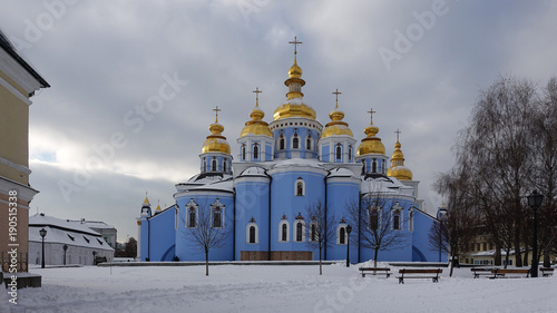 St. Michael's Cathedral in Kiev against the sky on a winter day. Snow on the ground in front of the cathedral photo