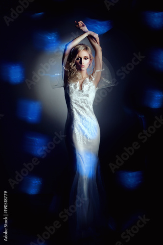 Bride model in studio on blue and black background