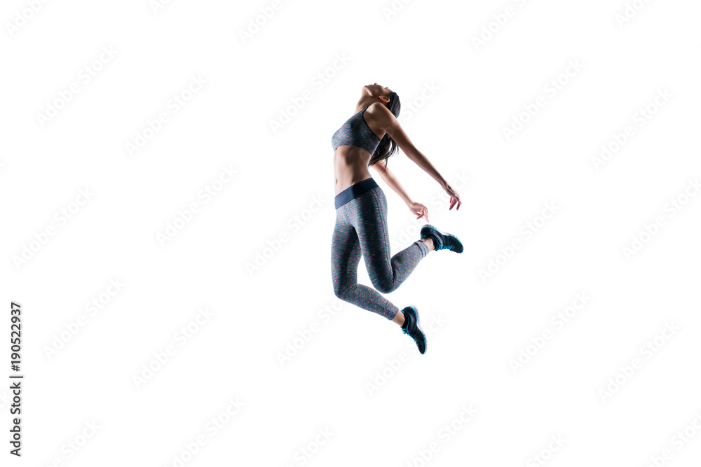 Deep breath after hard training! Concept of purity freedom. Side profile full-length portrait of fitness slender sporty woman is jumping up against white background, wearing sport outfit ans shoes