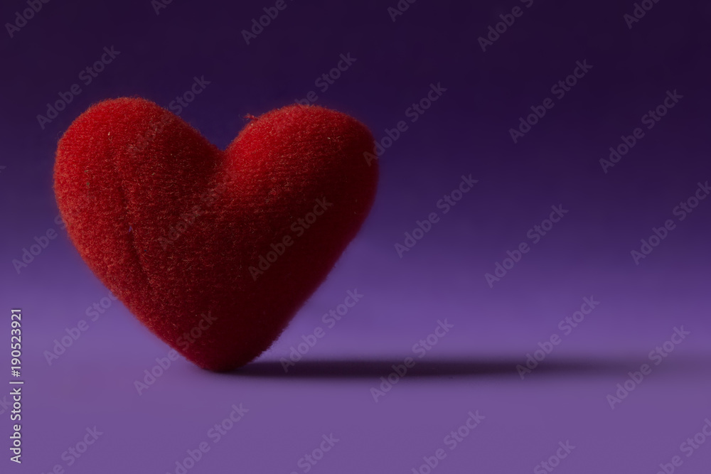 Red Heart stand alone on purple background. Valentine concept.