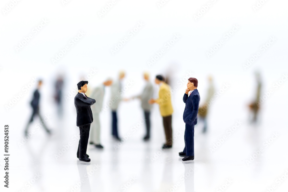 Miniature people: Group businessman negotiates business, planning. Image use for business concept. Miniature people: Group businessman negotiates business, planning. Image use for business concept.