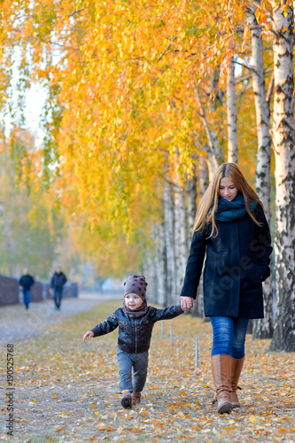 Mother with kids in autumn