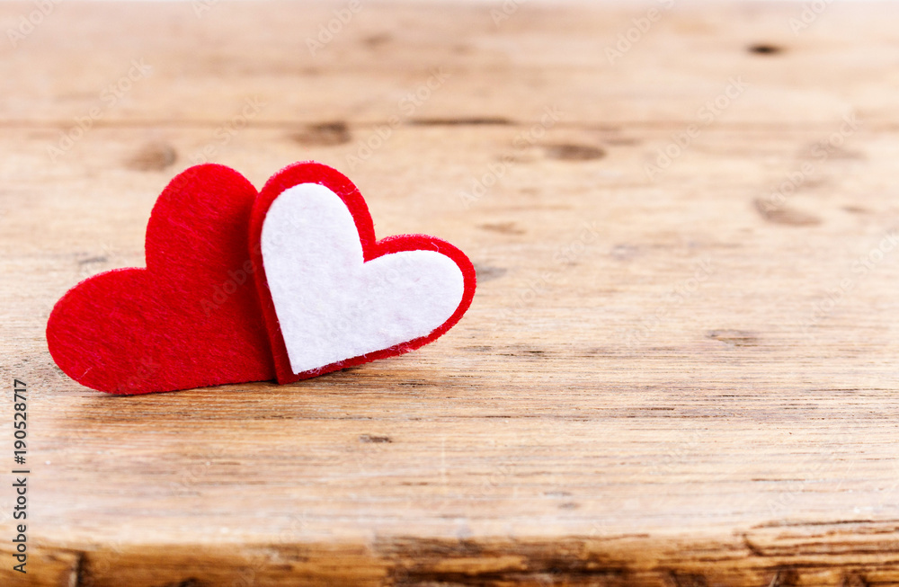 Valentine's Day Background with Small red heart on wooden table with copy space. Valentine's Day Background with Small red heart on wooden table with copy space.