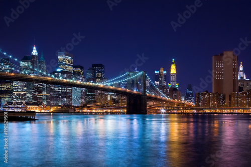 Skyline at night of New York City and Brooklyn Bridge