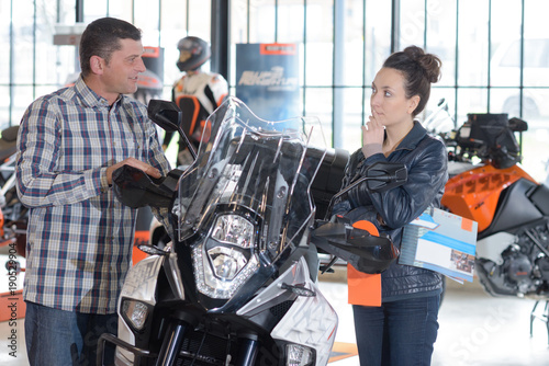 Couple debating purchase of motorcycle