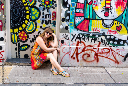 young woman against a graffiti background