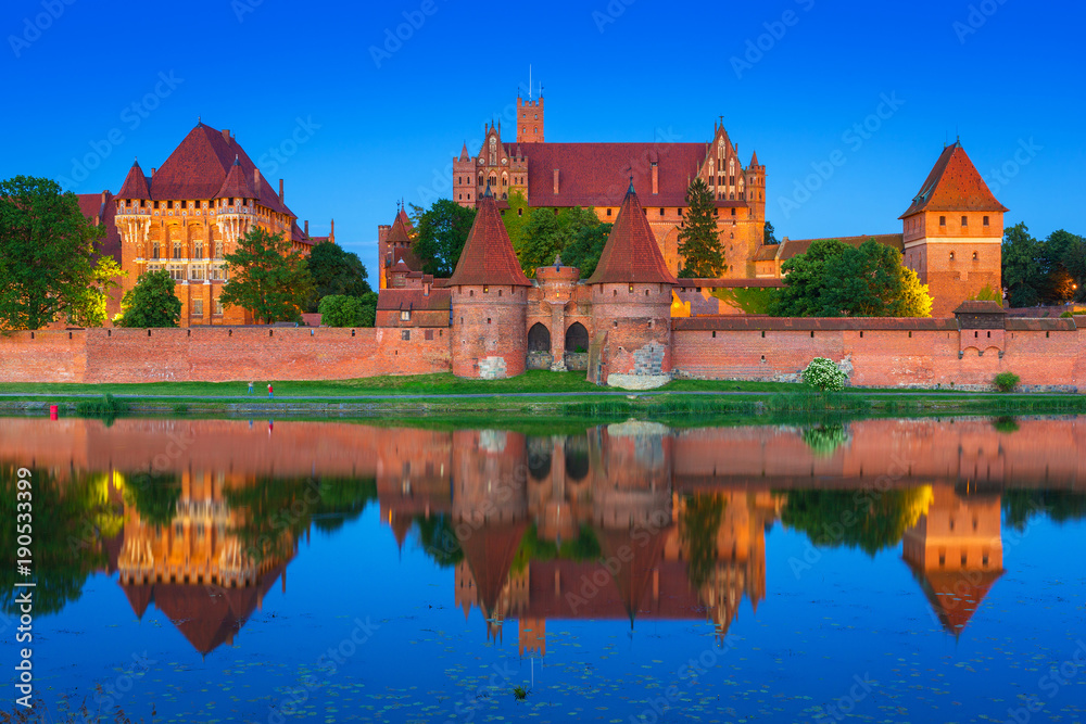 Malbork Castle of the Teutonic Order at dusk, Poland Malbork Castle of the Teutonic Order at dusk, Poland