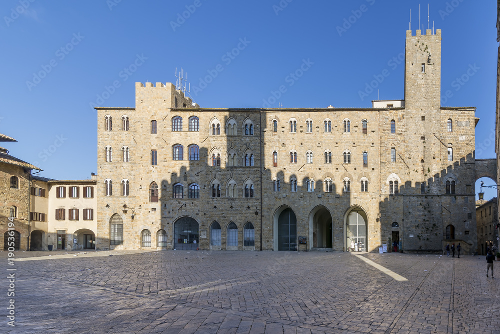 Pretorio Palace and Porcellino Tower, Priori square in a quiet moment of the day, Volterra, Pisa, Tuscany, Italy
